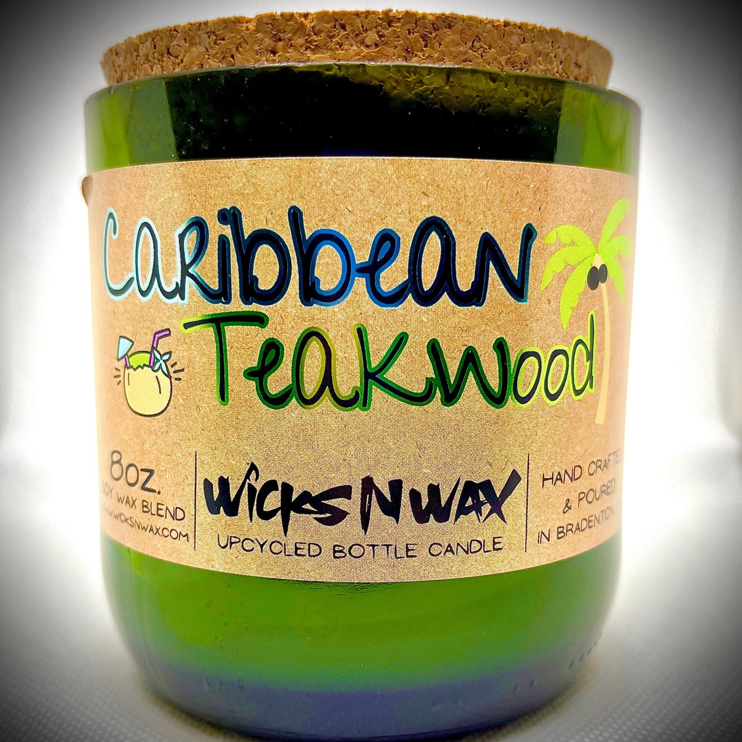 Recycled bottle candle with kraft label and green glass sleeve, Caribbean Teakwood lettering