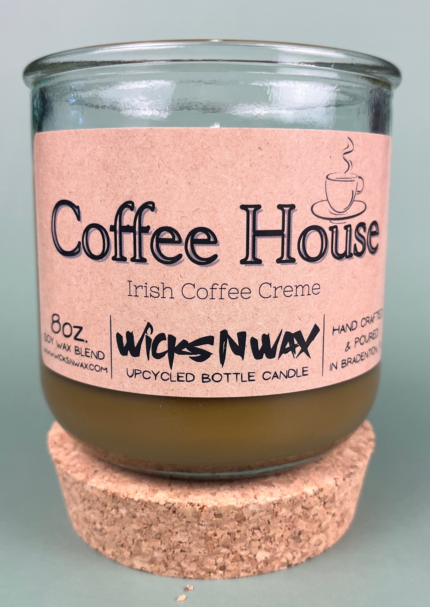 Recycled glass candle with cork base, amber wax, pink label: Coffee House Irish Coffee Creme