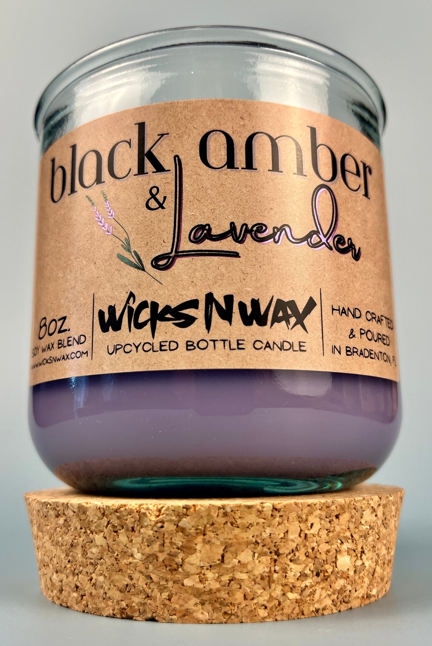 Recycled glass candle jar with cork base; purple wax and WicksNWax Black Amber & Lavender label