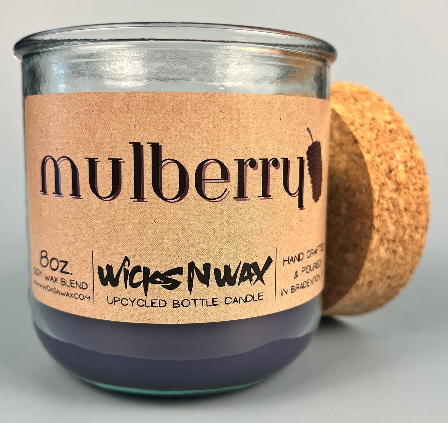 Mulberry WicksNWax upcycled bottle candle in clear glass jar, cork base and label