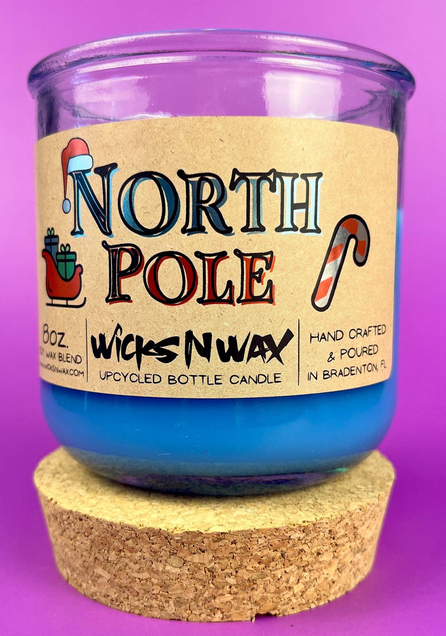 Recycled glass candle in blue wax with branded kraft label and cork coaster