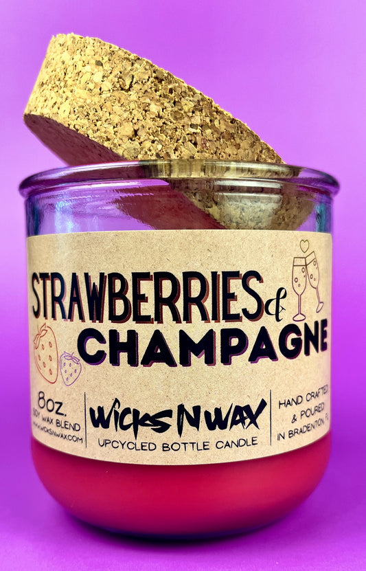Recycled glass candle with cork base and cork piece, red wax, 'Strawberries & Champagne'.