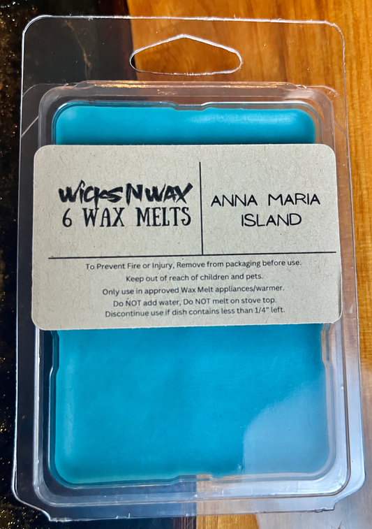 Teal wax melts in clear plastic clamshell with label card on top, 6 pieces