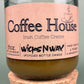 Recycled glass candle with cork base, amber wax, pink label: Coffee House Irish Coffee Creme