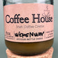 Recycled glass candle with cork base, amber wax, pink label: Coffee House Irish Coffee Creme