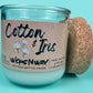 Recycled glass candle in clear jar with cork lid and “Cotton & Iris” kraft label