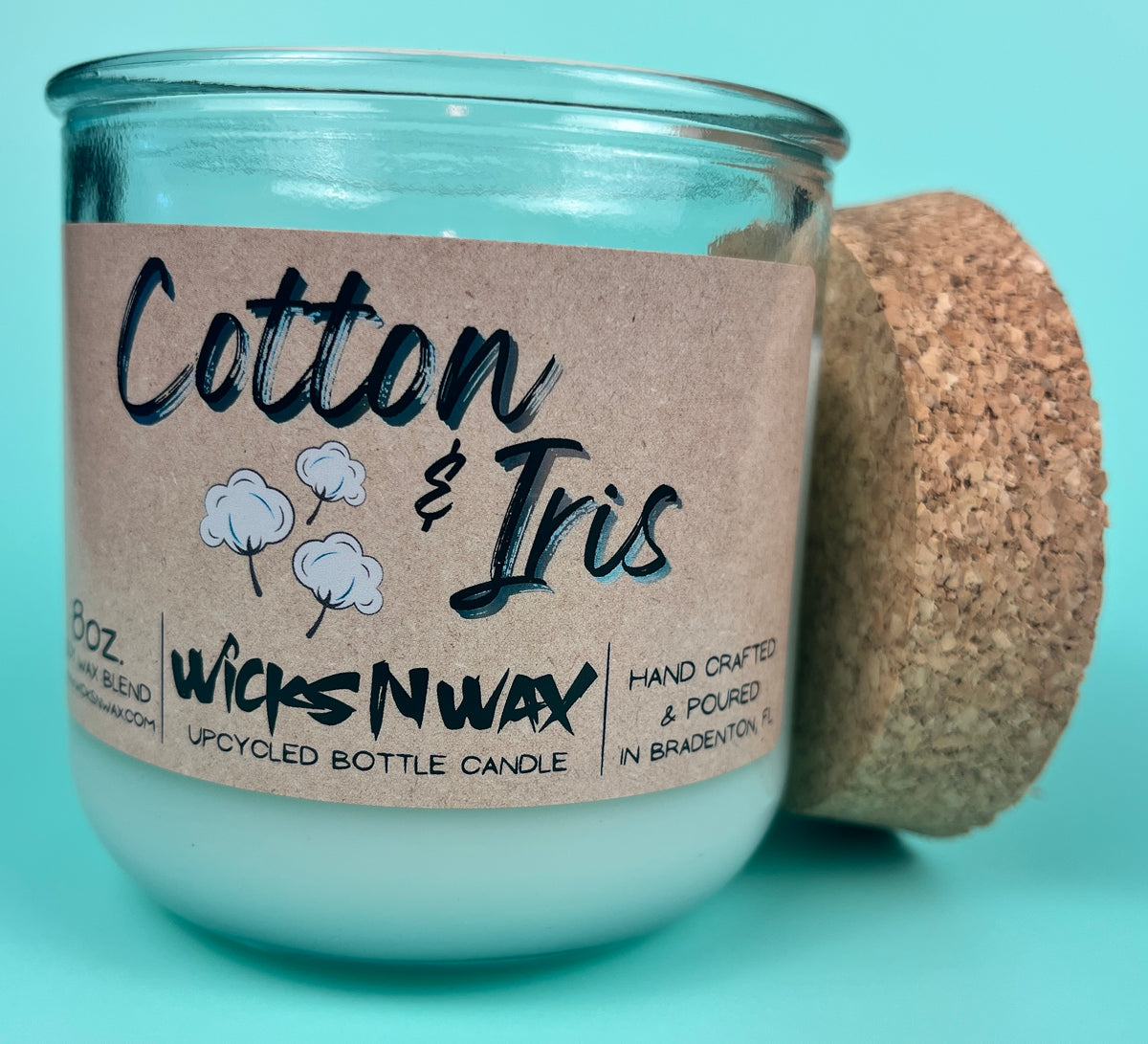 Recycled glass candle in clear jar with cork lid and “Cotton & Iris” kraft label