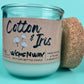 Recycled glass candle with cork lid and “Cotton & Iris” kraft label, side view