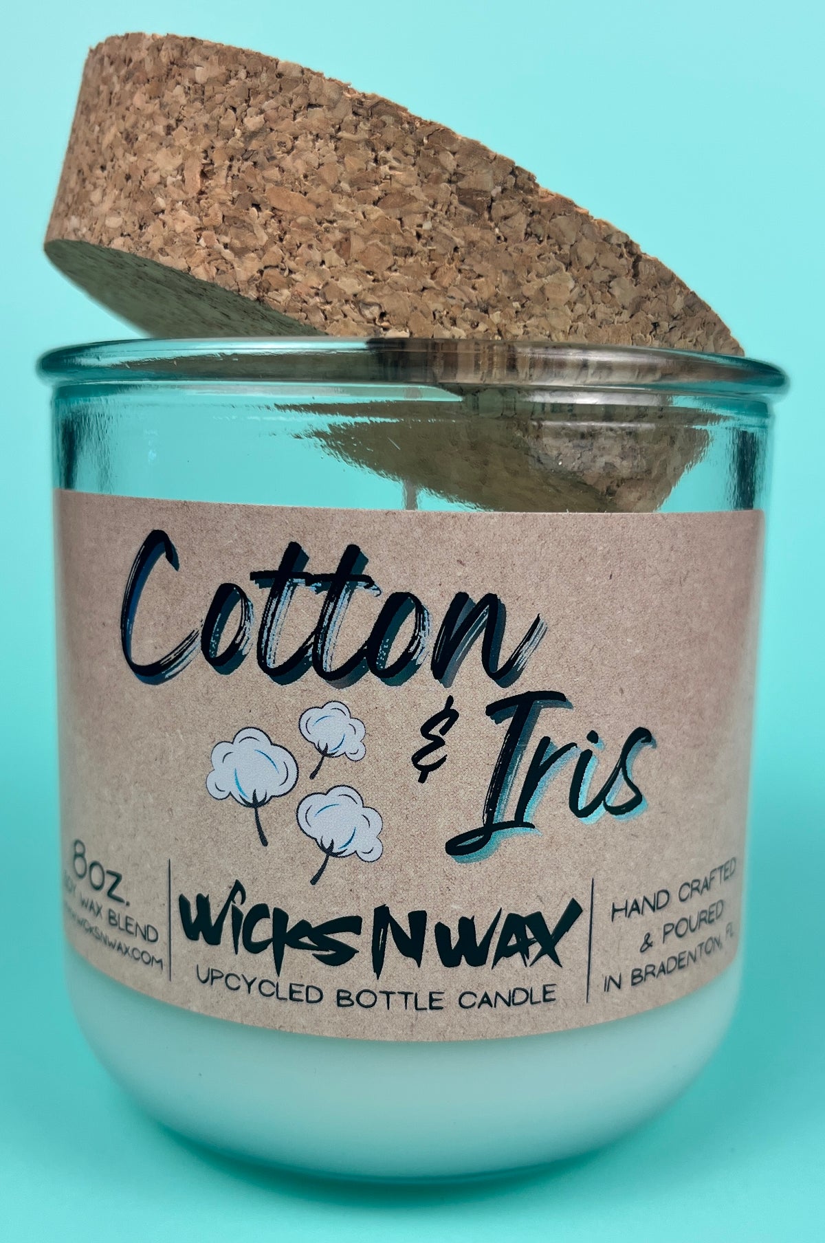 Recycled glass candle in clear jar with cork lid and kraft label “Cotton & Iris”