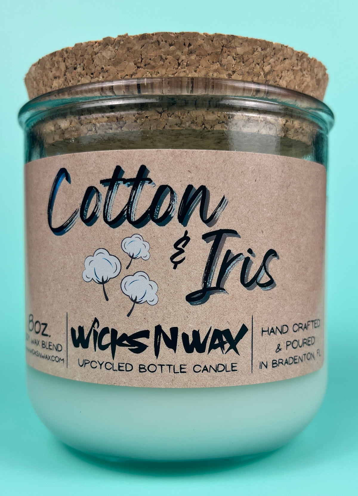 Recycled glass candle in clear jar with cork lid and “Cotton & Iris” kraft label