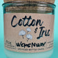 Recycled glass candle with cork lid and “Cotton & Iris” kraft label, front view