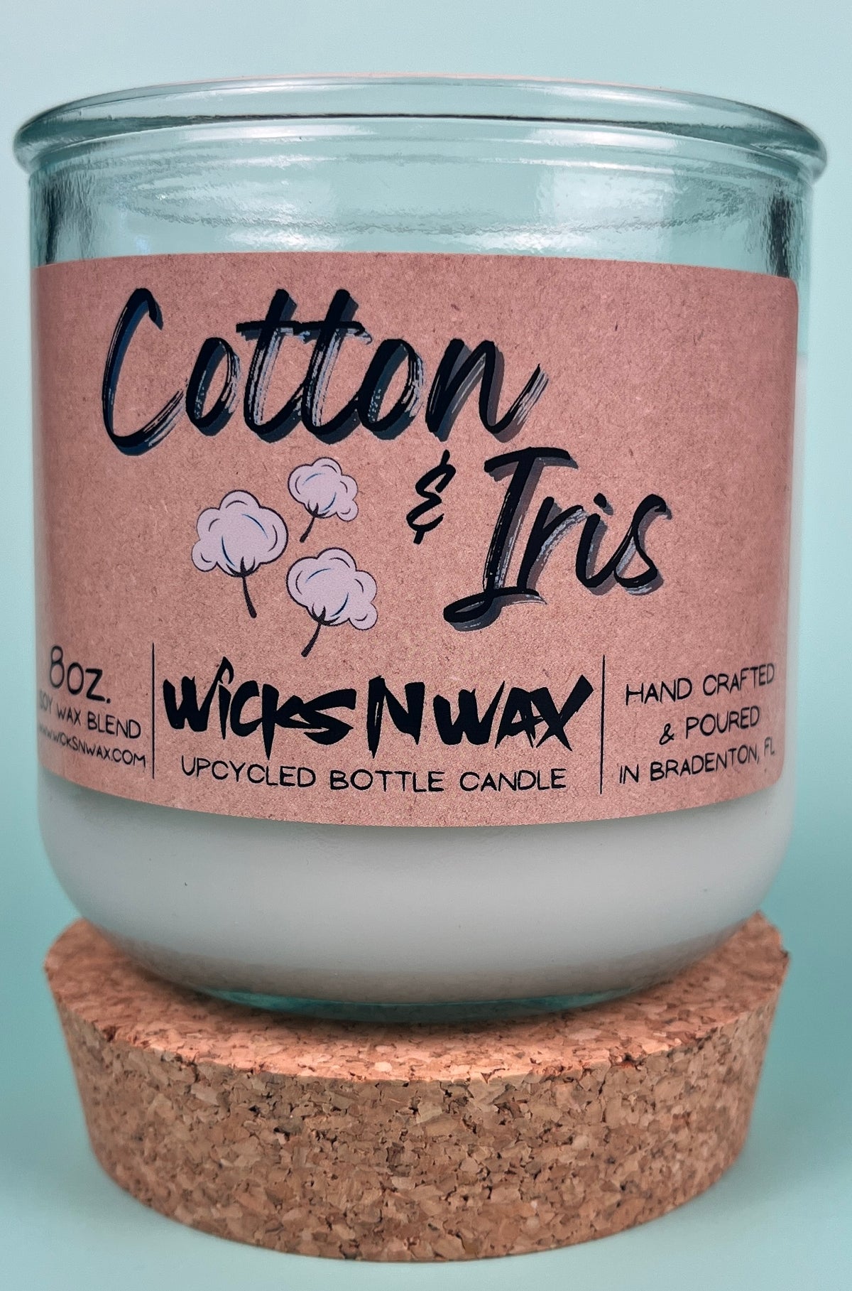 Recycled glass candle with kraft label “Cotton & Iris” and cork base