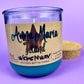 Recycled glass bottle candle with blue wax, beige label, and cork lid; visible wick