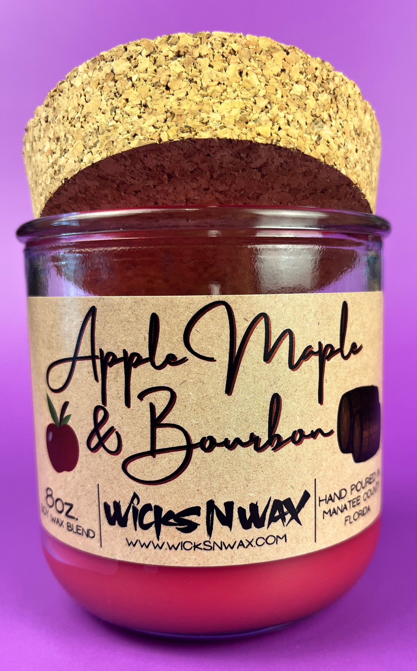 Recycled glass candle with red wax and kraft Apple Maple & Bourbon label