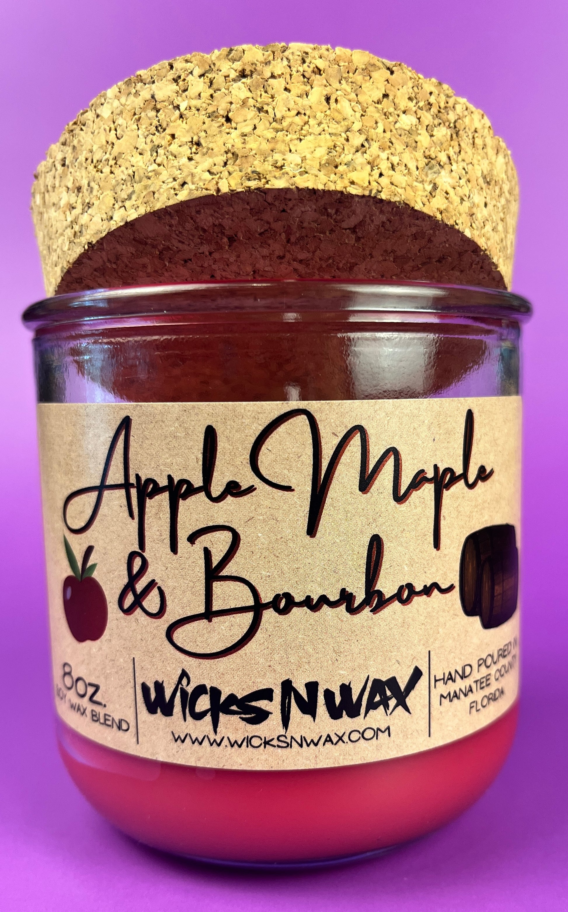 Recycled glass candle with red wax and kraft Apple Maple & Bourbon label