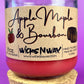 Apple Maple & Bourbon candle with red wax, WicksNWax label, cork base