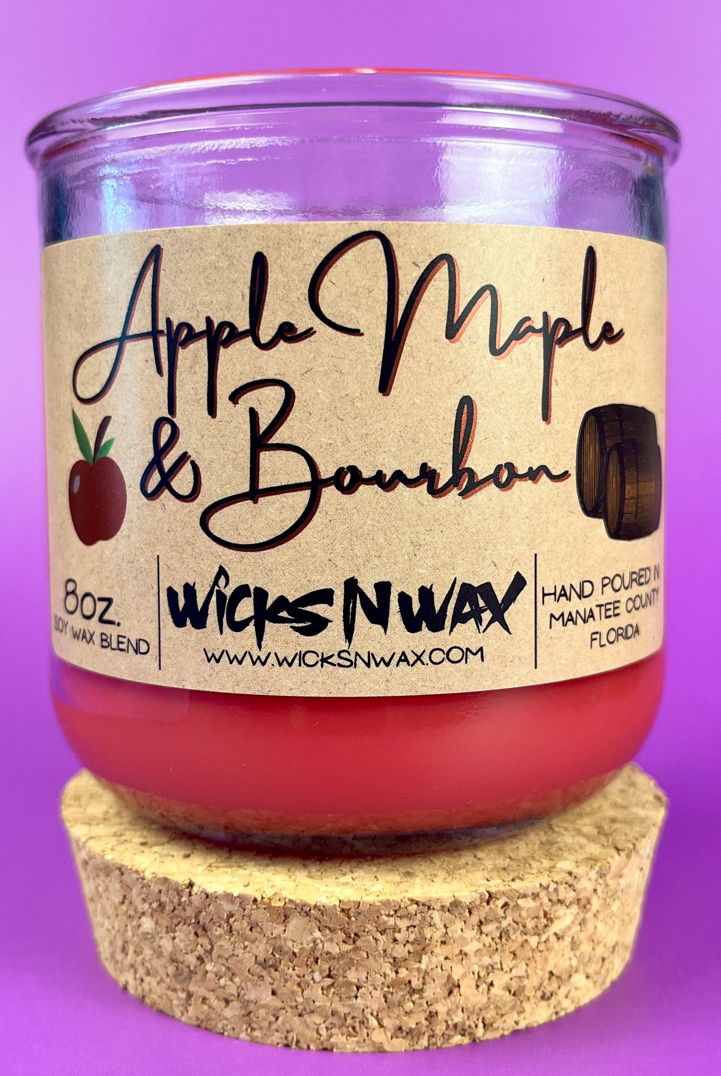 Apple Maple & Bourbon candle with red wax, WicksNWax label, cork base