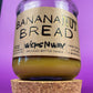 Recycled glass candle jar with Banana Nut Bread kraft label and beige wax
