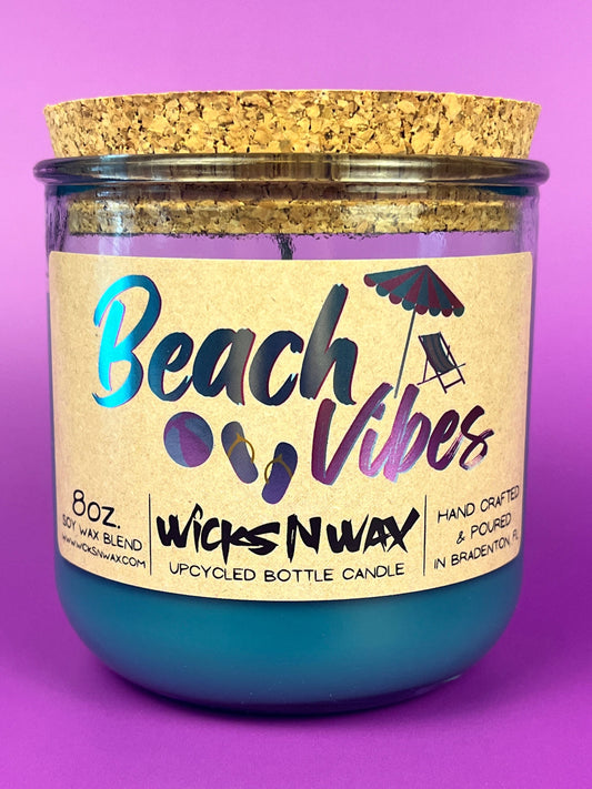 Recycled glass candle in blue jar with cork lid and Beach Vibes label, 8 oz
