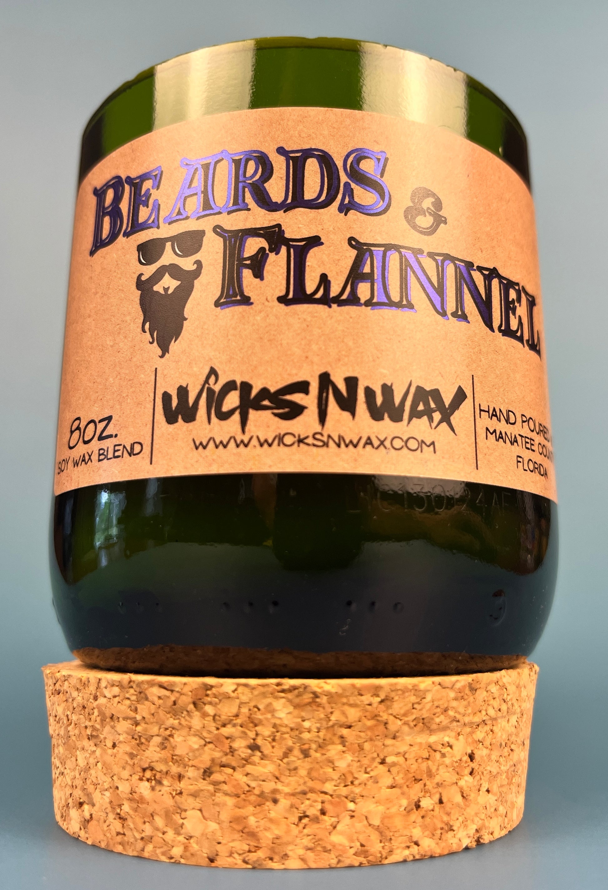 Dark green candle jar with cork base and Beards & Flannel printed label