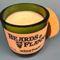 Dark green candle jar with Beards & Flannel label; cream wax top visible
