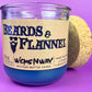 Blue recycled bottle candle with cork lid, front label "Beards & Flannel".