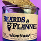 Blue recycled glass candle with cork lid and front label "Beards & Flannel".
