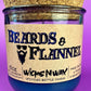 Blue recycled glass candle with cork lid; front label shows "Beards & Flannel".