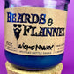 Blue candle with cork base and label "Beards & Flannel" on a glass jar.