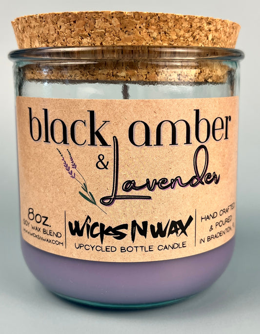 Recycled glass candle jar with cork lid and purple wax; WicksNWax Black Amber & Lavender label close