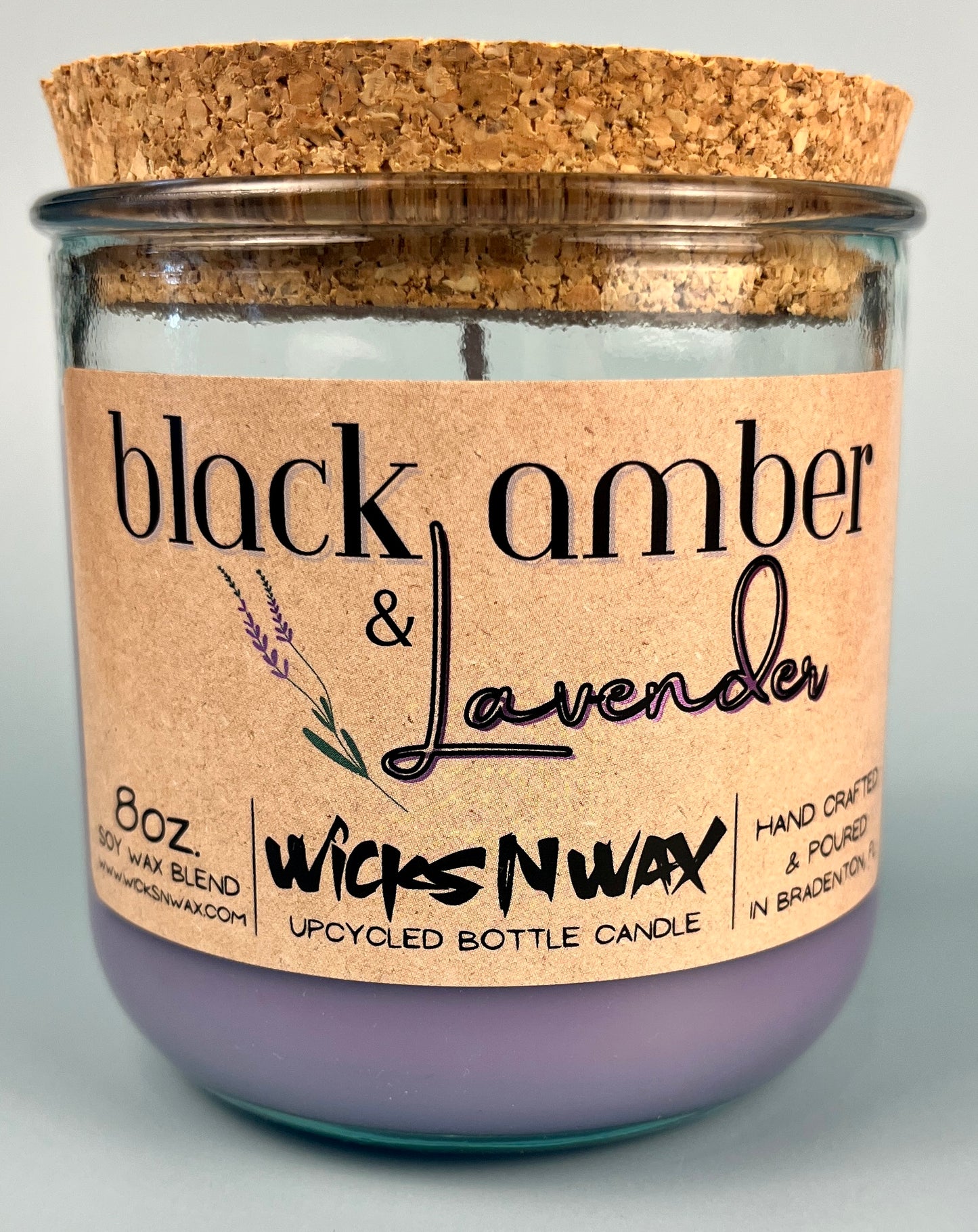 Front view recycled glass candle jar with cork lid and purple wax; WicksNWax Black Amber & Lavender