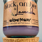 Recycled glass candle jar with cork base; purple wax and WicksNWax Black Amber & Lavender label