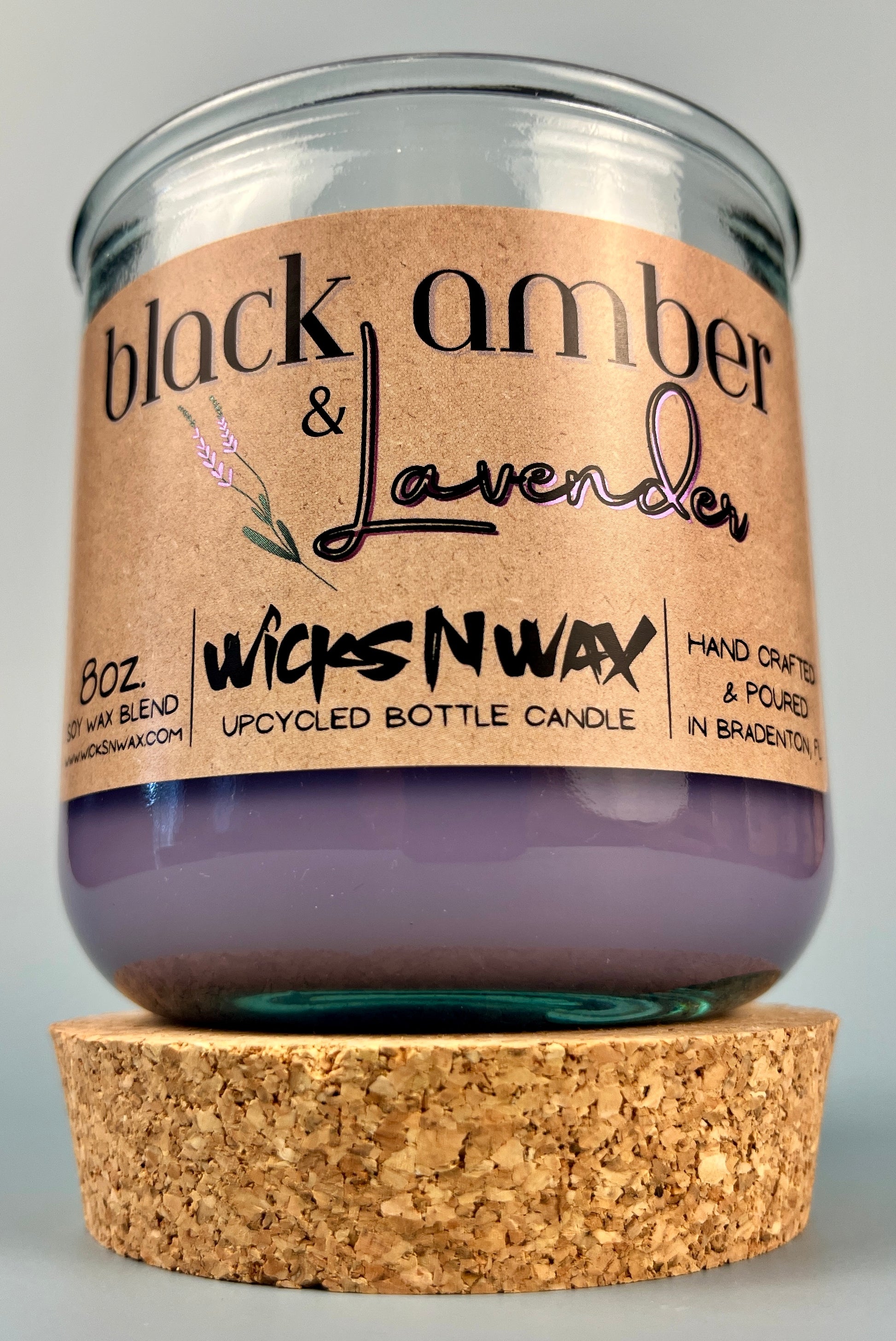 Recycled glass candle jar with cork base; purple wax and WicksNWax Black Amber & Lavender label
