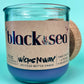 Recycled glass jar candle with blue wax and kraft label on front
