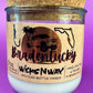 Recycled glass candle jar with printed Bradentucky label and white wax