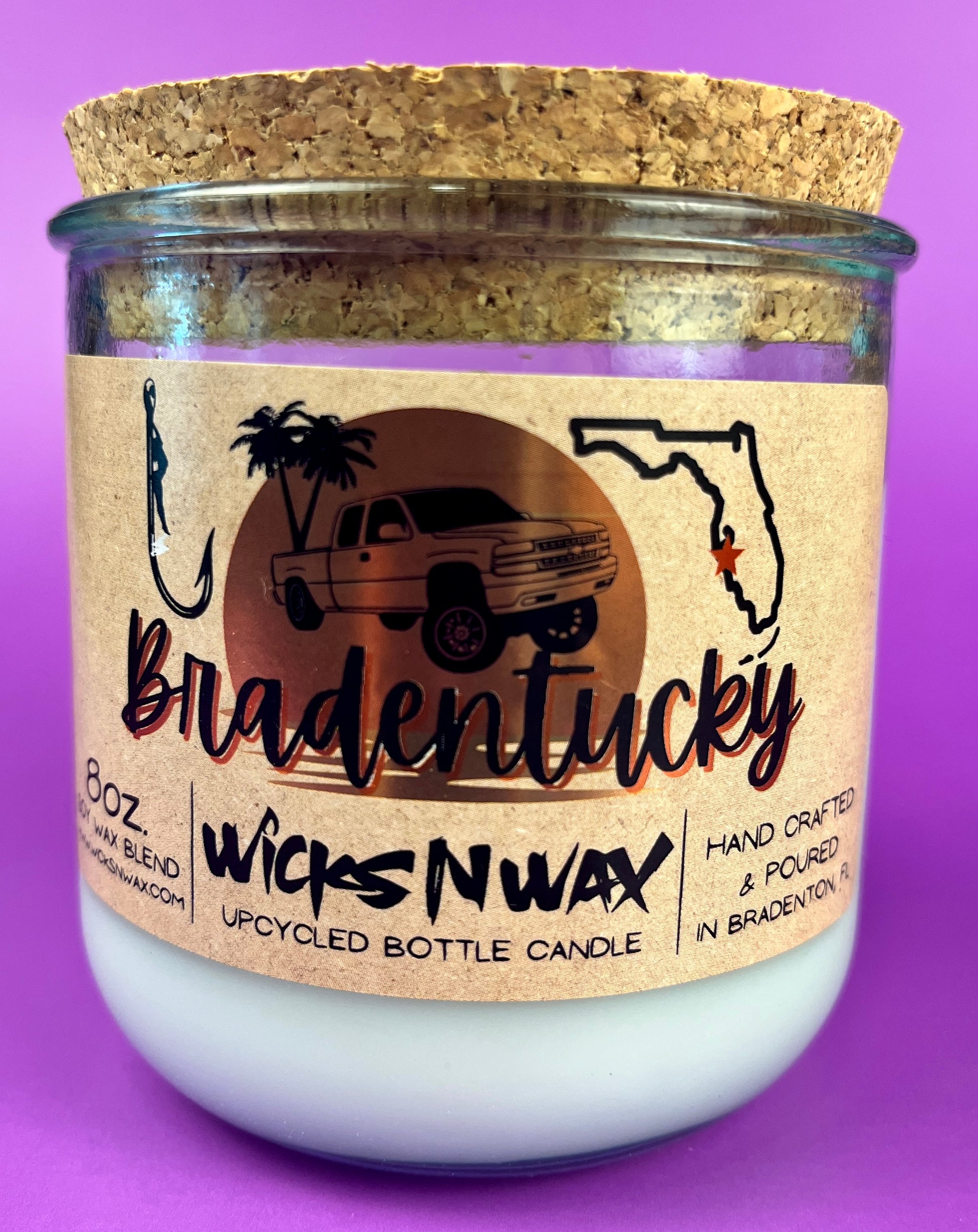 Recycled glass candle jar with printed Bradentucky label and white wax