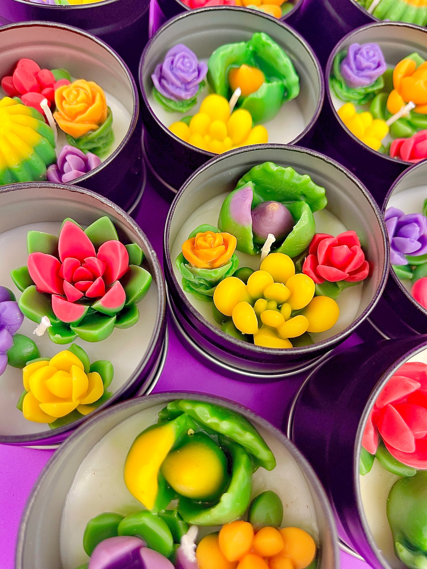 Small cactus art tin set with colorful flower-shaped wax pieces in silver cups