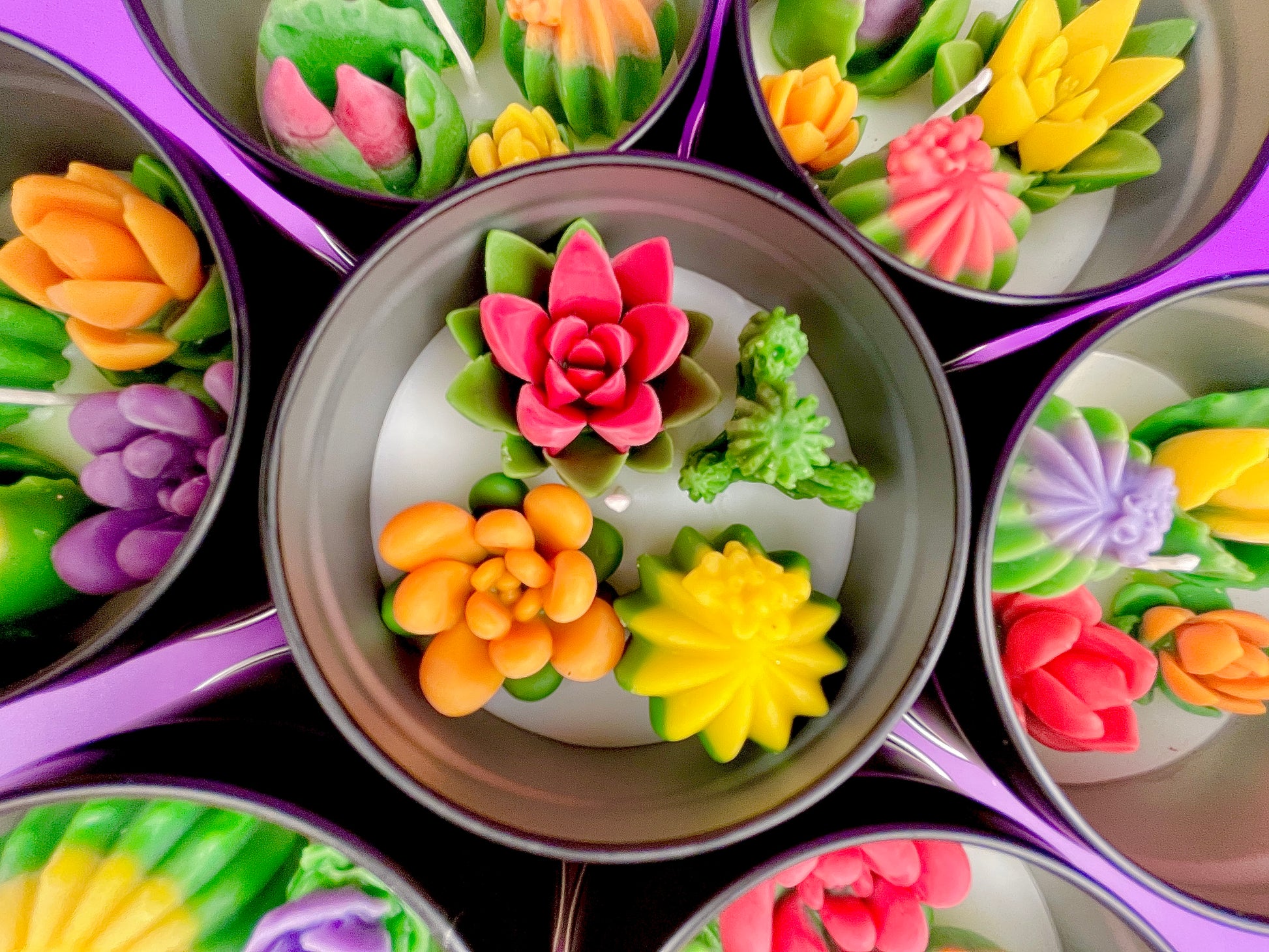 Large cactus art tin with a center lotus-style flower and orange green wax pieces