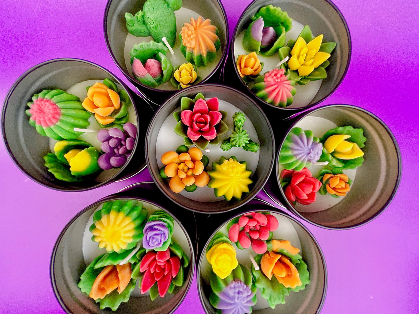 Large cactus art tin with assorted flower-shaped wax pieces in red, orange, yellow and purple
