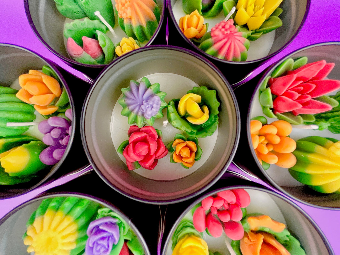 Large cactus art tin with close-up flower-shaped wax pieces in pink, yellow and green