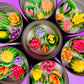 Large cactus art tin with multiple small flower-shaped wax pieces in pink, orange, purple and green