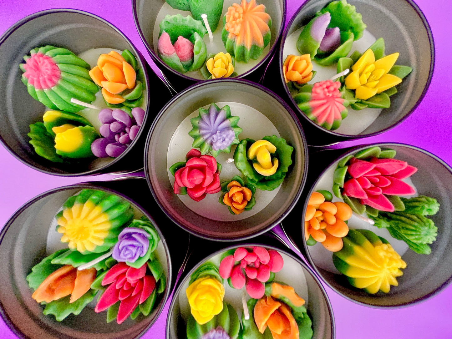 Large cactus art tin with multiple small flower-shaped wax pieces in pink, orange, purple and green