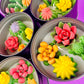 Large cactus art tin with bright yellow, red, orange and green flower-shaped wax pieces