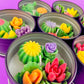 Large cactus art tin with assorted green, purple, yellow and pink flower-shaped wax pieces