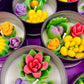 Small cactus art tin set with stacked cups of yellow, pink, purple, and green wax