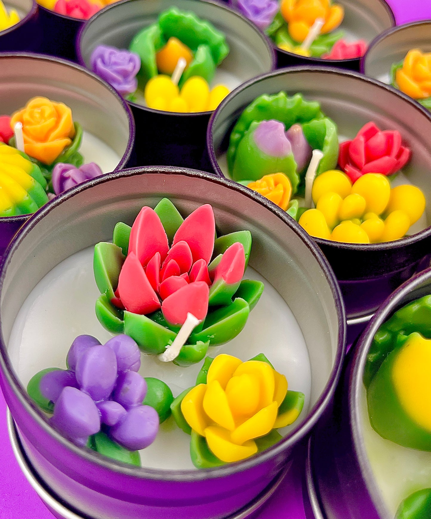 Small cactus art tin set with central red rose wax and surrounding purple and green wax