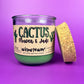 Recycled glass candle in purple jar with green wax and tan cork lid