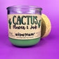 Recycled glass candle jar with printed cactus-style label, green wax, tan cork lid