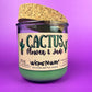 Recycled glass candle jar with printed label, green wax, and tan cork lid