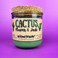 Recycled glass candle jar with printed label, green wax, and tan cork lid